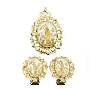Asian motif man silhouette pendant & clip on earrings gold tone filigree set